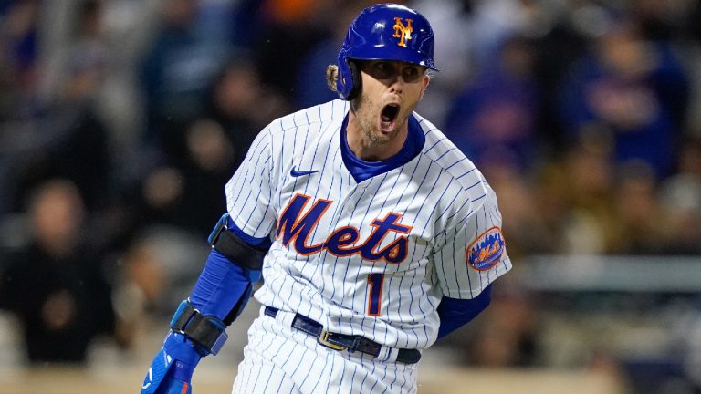 New York Mets Jeff McNeil (1) reacts as he heads up the first base line after hitting a two-run double against the San Diego Padres during the seventh inning of Game 2 of a National League wild-card baseball playoff series, Saturday, Oct. 8, 2022, in New York. (John Minchillo/AP)