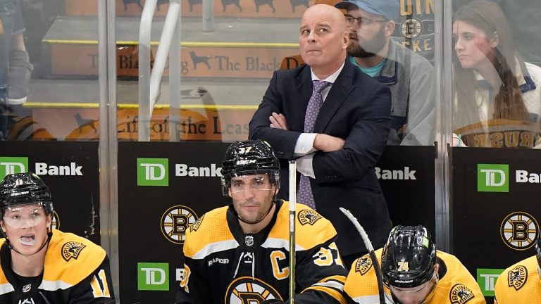 Boston Bruins coach Jim Montgomery watches from the bench during the third period of the team's NHL hockey game against the Anaheim Ducks, Thursday, Oct. 20, 2022, in Boston. (Steven Senne/AP)