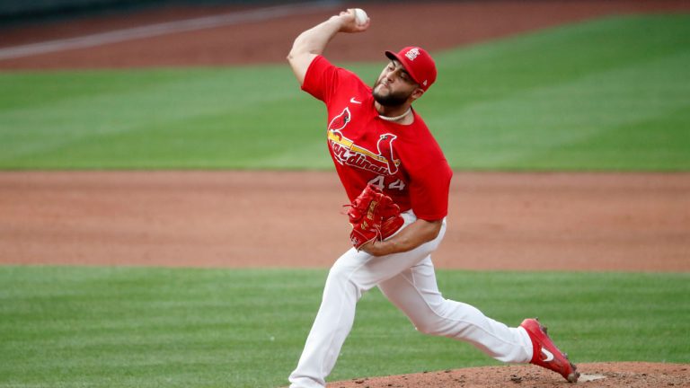 St. Louis Cardinals pitcher Junior Fernandez throws during baseball practice at Busch Stadium. (Jeff Roberson/AP)