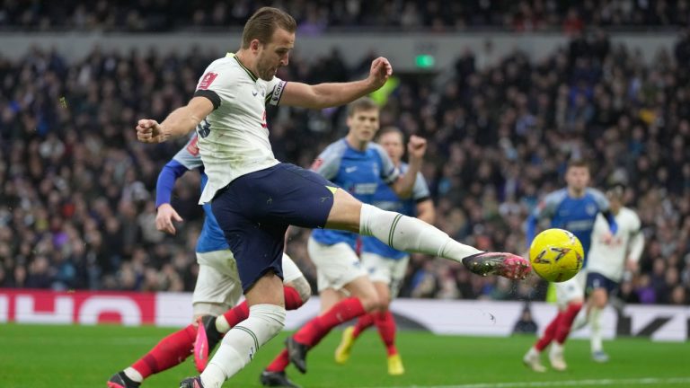 Tottenham's Harry Kane shoots in an attempt to score during the English FA Cup soccer match between Tottenham Hotspur and Portsmouth at Tottenham Hotspur Stadium in London, Saturday, Jan. 7, 2023. (Kin Cheung/AP)