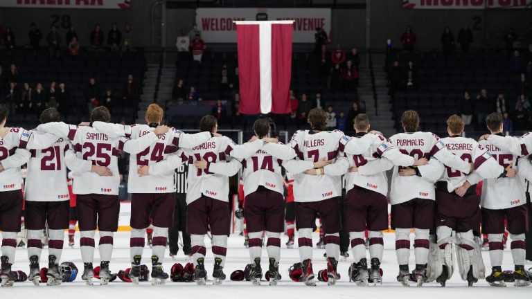 Members of Team Latvia celebrate their win over Austria during IIHF World Junior Hockey Championship relegation action in Halifax on Wednesday, January 4, 2023. (Darren Calabrese/CP) 