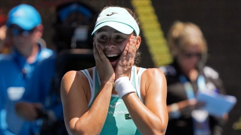 Magda Linette of Poland celebrates after defeating Karolina Pliskova of the Czech Republic in their quarterfinal match at the Australian Open tennis championship in Melbourne, Australia, Wednesday, Jan. 25, 2023. (Dita Alangkara/AP Photo)