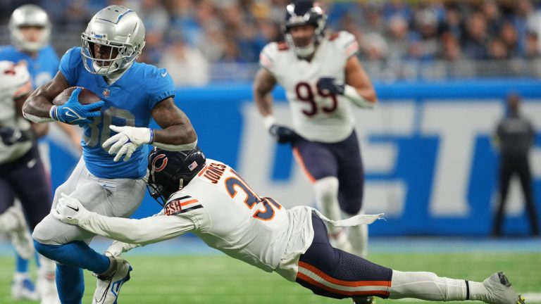 Jamaal Williams #30 of the Detroit Lions is tackled by Jaylon Jones #31 of the Chicago Bears during the second quarter at Ford Field on January 01, 2023 in Detroit, Michigan. (Nic Antaya/Getty Images)