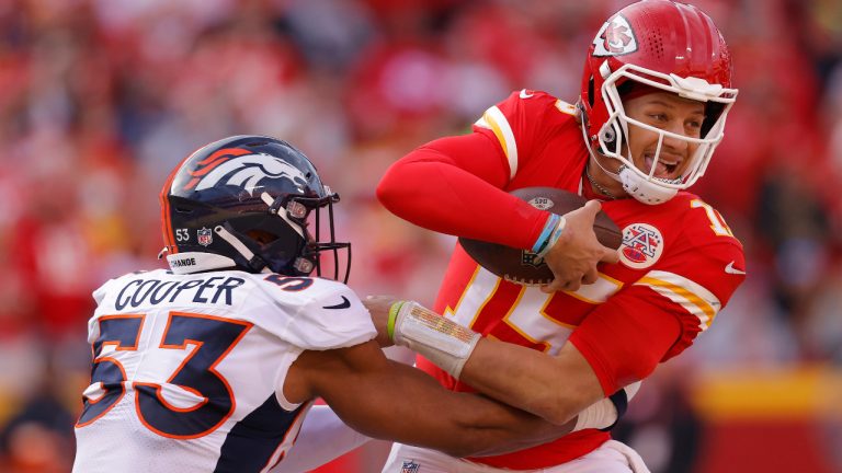 Patrick Mahomes #15 of the Kansas City Chiefs is tackled by Jonathon Cooper #53 of the Denver Broncos during the second half at Arrowhead Stadium on January 01, 2023 in Kansas City, Missouri. (David Eulitt/Getty Images)