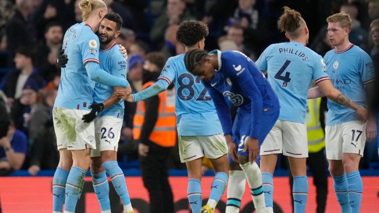 Manchester City's players celebrate after the English Premier League soccer match between Chelsea and Manchester City at Stamford Bridge stadium in London Thursday, Jan. 5, 2023. (Kirsty Wigglesworth/AP)