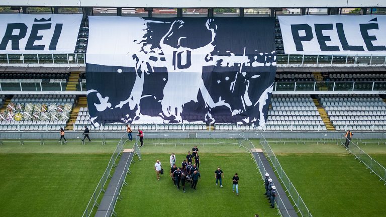 The coffin with the remains of Brazilian soccer great Pele is carried on the pitch of the Vila Belmiro stadium in Santos, Brazil. (Matias Delacroix/AP)