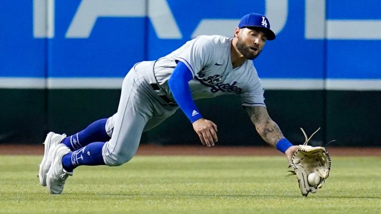 Los Angeles Dodgers left fielder Kevin Pillar makes a diving catch on a fly ball hit by Arizona Diamondbacks' Geraldo Perdomo during the fourth inning of a baseball game Sunday, May 29, 2022, in Phoenix. (Ross D. Franklin/AP)