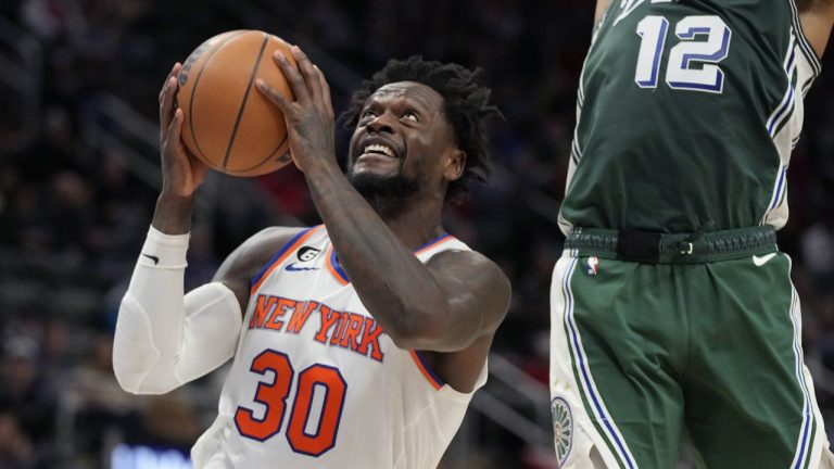 New York Knicks forward Julius Randle (30) attempts a layup as Detroit Pistons forward Isaiah Livers (12) defends during the second half of an NBA basketball game, Sunday, Jan. 15, 2023, in Detroit. (Carlos Osorio/AP)
