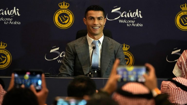 Cristiano Ronaldo smiles during a press conference for his official unveiling as a new member of Al Nassr soccer club in in Riyadh, Saudi Arabia, Tuesday, Jan. 3, 2023. Ronaldo, who has won five Ballon d'Ors awards for the best soccer player in the world and five Champions League titles, will play outside of Europe for the first time in his storied career. (Amr Nabil/AP)