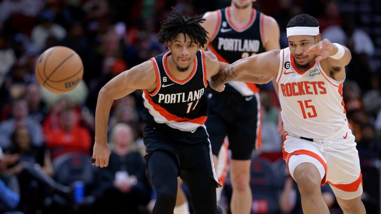 Portland Trail Blazers guard Shaedon Sharpe (17) and Houston Rockets guard Daishen Nix (15) scramble for a loose ball during the second half of an NBA basketball game Saturday, Dec. 17, 2022, in Houston. (AP Photo)