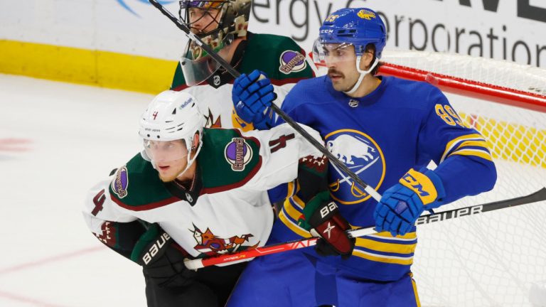 Arizona Coyotes defenceman Juuso Valimaki (4) and Buffalo Sabres right wing Alex Tuch (89) battle for position during the third period of an NHL hockey game, Tuesday, Nov. 8, 2022, in Buffalo, N.Y. (Jeffrey T. Barnes/AP) 