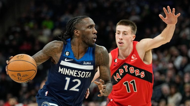 Minnesota Timberwolves forward Taurean Prince (12) works toward the basket while defended by Toronto Raptors guard Joe Wieskamp (11) during the first half of an NBA basketball game Thursday, Jan. 19, 2023, in Minneapolis. (Abbie Parr/AP)