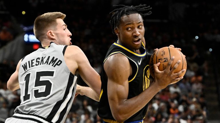 Golden State Warriors' Jonathan Kuminga (00) drives against San Antonio Spurs' Joe Wieskamp during the first half of an NBA basketball game on Saturday, April 9, 2022, in San Antonio. (Darren Abate/AP)