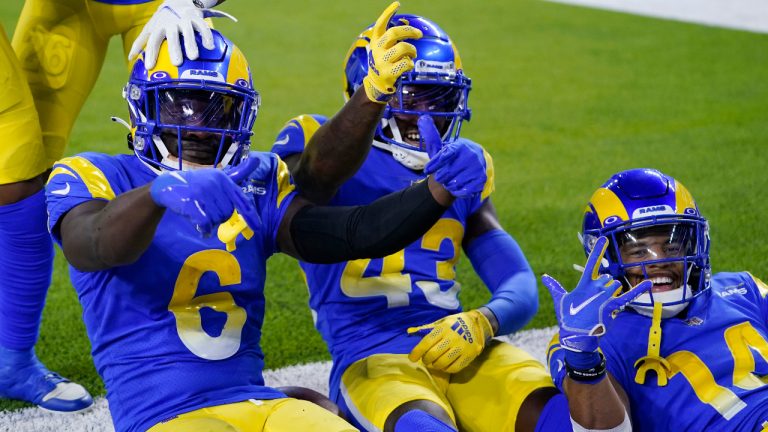 Los Angeles Rams cornerback Derion Kendrick (6) celebrates with Russ Yeast II (43) and Cobie Durant (14) after Kendrick's fumble recovery during the first half of a preseason NFL football game against the Houston Texans Friday, Aug. 19, 2022, in Inglewood, Calif. (AP Photo/Ashley Landis ) 