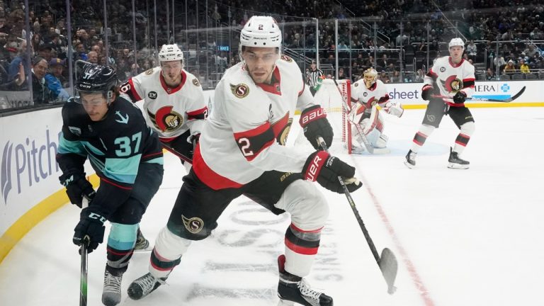 Seattle Kraken center Yanni Gourde (37) skates against Ottawa Senators defenseman Artem Zub (2) during the second period of an NHL hockey game, Monday, April 18, 2022, in Seattle. (AP)