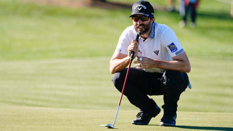 Adam Hadwin lines up a putt on the ninth green during the first round of the Phoenix Open golf tournament Thursday, Feb. 9, 2023, in Scottsdale, Ariz. Hadwin finished at five under par and is tied for the lead. (Darryl Webb/AP)