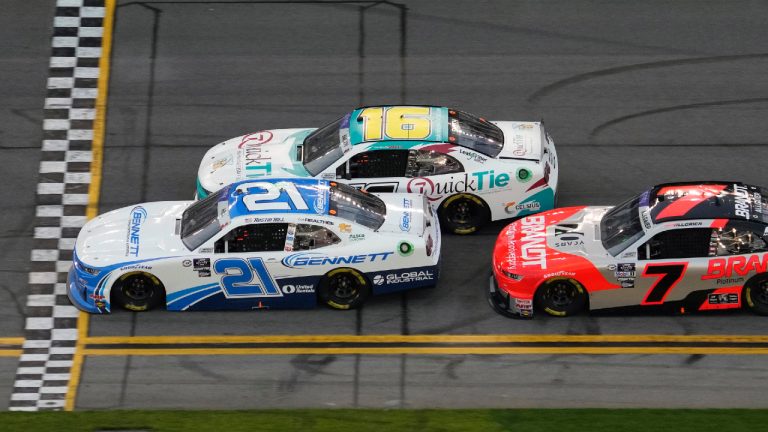 Austin Hill (21) beats Chandler Smith (16) to the start/finish line to win the first stage during the NASCAR Xfinity Series auto race Saturday, Feb. 18, 2023, at Daytona International Speedway in Daytona Beach, Fla. Finishing third is Justin Allgaier (7). (Chris O'Meara/AP)