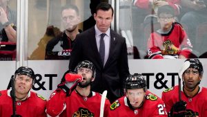 Chicago Blackhawks head coach Luke Richardson, top centre, watches the second period of an NHL hockey game against the Seattle Kraken in Chicago, Sunday, Oct. 23, 2022. (Nam Y. Huh/AP)