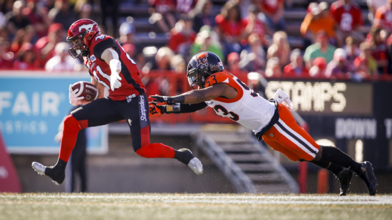 B.C. Lions' Jordan Herdman-Reed (53) dives for Calgary Stampeders' Michael Klukas during first half CFL football action in Calgary, Saturday, June 29, 2019. (CP)