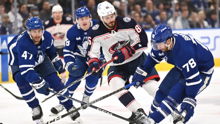 Toronto Maple Leafs defenceman T. J. Brodie (78) controls the puck against Columbus Blue Jackets right winger Kirill Marchenko (86) during first period NHL action.(Jon Blacker/CP)