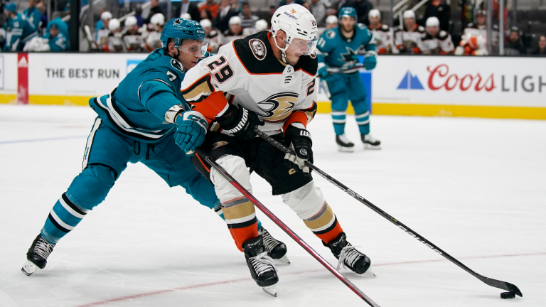 San Jose Sharks center Nico Sturm, left, reaches for the puck behind Anaheim Ducks defenseman Dmitry Kulikov (29) during the first period of an NHL hockey game in San Jose, Calif., Tuesday, Nov. 1, 2022. (AP)