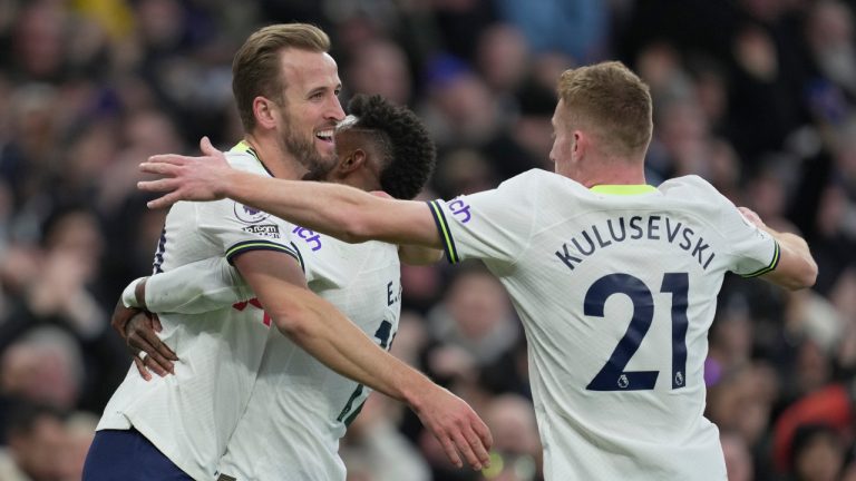 Tottenham's Harry Kane, left, celebrates with team mates after scoring the opening goal during an English Premier League soccer match between Tottenham Hotspur v Manchester City at the Tottenham Hotspur Stadium in London, Sunday, Feb. 5, 2023. (Kin Cheung/AP) 