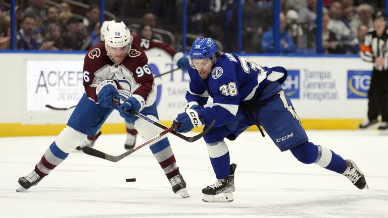 Tampa Bay Lightning left wing Brandon Hagel (38) breaks out ahead of Colorado Avalanche right wing Mikko Rantanen (96) during the second period of an NHL hockey game Thursday, Feb. 9, 2023, in Tampa, Fla. (Chris O'Meara/AP)