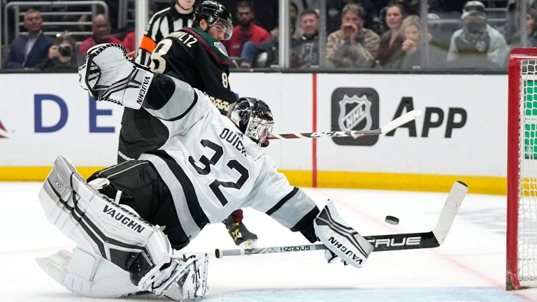 Los Angeles Kings goaltender Jonathan Quick, right, stops a shot by Arizona Coyotes center Nick Schmaltz during a shootout in an NHL hockey game. (Mark J. Terrill/AP)