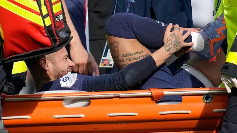 PSG's Neymar is carried off the field on a stretcher after after injuring during the French League One soccer match between Paris Saint-Germain and Lille at the Parc des Princes stadium, in Paris, France, Sunday, Feb. 19, 2023. (AP Photo/Christophe Ena)