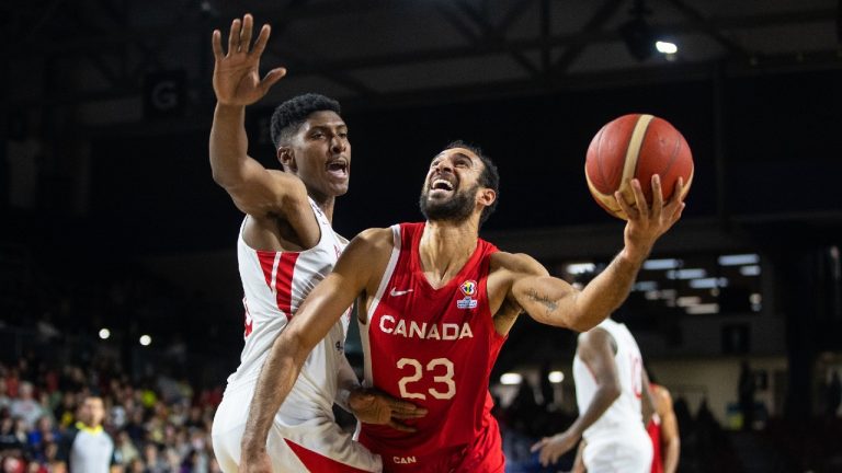 Canada's Phil Scrubb (23) drives to the hoop past Panama's Eric Romero (16) during first half FIBA World Cup Qualifiers action in Edmonton, Sunday, Nov. 13, 2022. (CP)