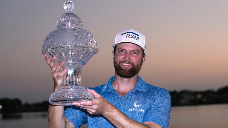 Chris Kirk holds the trophy after winning the Honda Classic golf tournament in a playoff against Eric Cole, Sunday, Feb. 26, 2023, in Palm Beach Gardens, Fla.  (Lynne Sladky/AP)