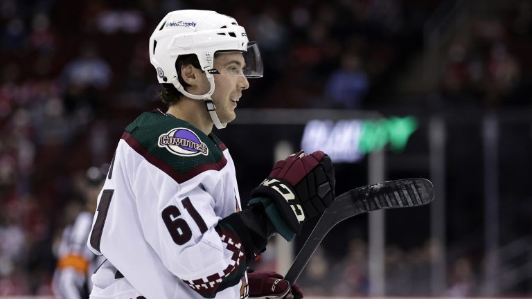 Arizona Coyotes defenseman Dysin Mayo reacts after scoring a goal against the New Jersey Devils during the second period of an NHL hockey game Wednesday, Jan. 19, 2022, in Newark, N.J. (Adam Hunger/AP)