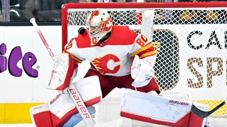 Calgary Flames goaltender Dan Vladar defends the net against the Vegas Golden Knights during the first period of an NHL hockey game. (David Becker/AP)