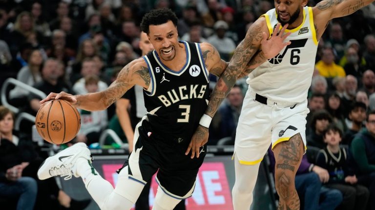 Milwaukee Bucks' George Hill tries to get past Utah Jazz's Nickeil Alexander-Walker during the first half of an NBA basketball game Saturday, Dec. 17, 2022, in Milwaukee. (Morry Gash/AP)