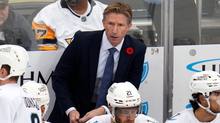 Seattle Kraken head coach Dave Hakstol stands behind his bench during the third period of an NHL hockey game against the Pittsburgh Penguins in Pittsburgh, Saturday, Nov. 5, 2022. The Kraken won 3-2. (Gene J. Puskar/AP)