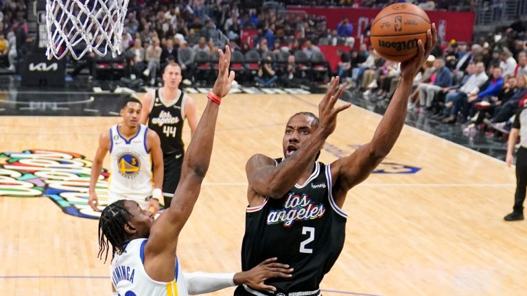 Los Angeles Clippers forward Kawhi Leonard, right, shoots as Golden State Warriors forward Jonathan Kuminga defends during the first half of an NBA basketball game Tuesday, Feb. 14, 2023, in Los Angeles. (Mark J. Terrill/AP Photo)