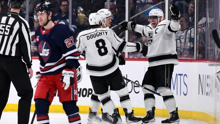 Los Angeles KingsÕ Anze Kopitar (11) celebrates his goal against the Winnipeg Jets with Drew Doughty (8) during second period NHL action in Winnipeg on Tuesday February 28, 2023. (Fred Greenslade/CP)