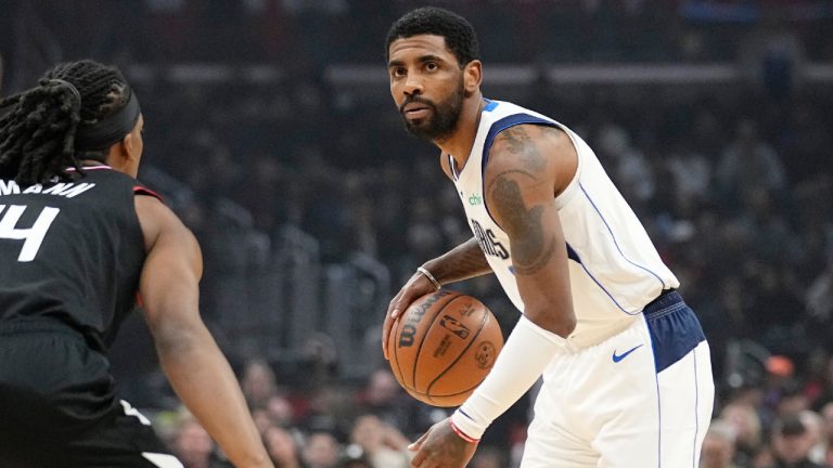 Dallas Mavericks guard Kyrie Irving, right, dribbles as Los Angeles Clippers guard Terance Mann defends during the first half of an NBA basketball game Wednesday, Feb. 8, 2023, in Los Angeles. (Mark J. Terrill/AP)