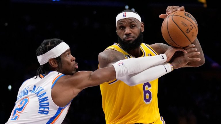 Los Angeles Lakers forward LeBron James, right, is fouled by Oklahoma City Thunder guard Shai Gilgeous-Alexander during the second half of an NBA basketball game Tuesday, Feb. 7, 2023, in Los Angeles. (Ashley Landis/AP)