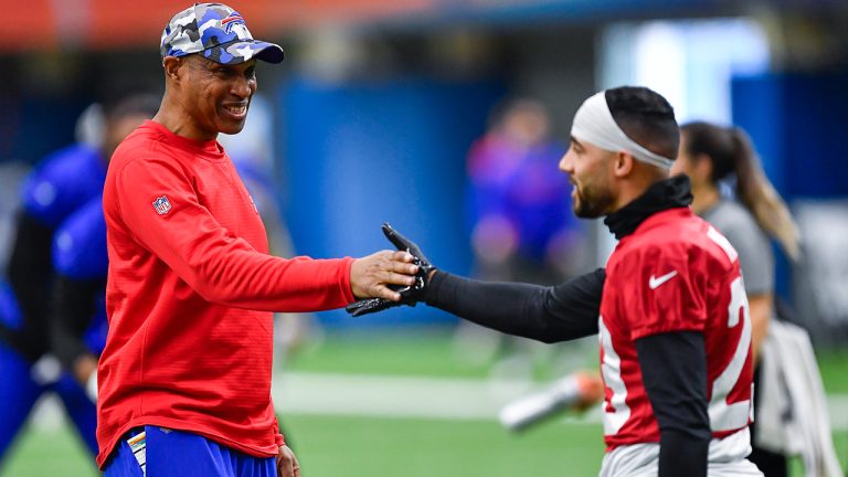 Buffalo Bills defensive coordinator Leslie Frazier, left, greets safety Micah Hyde during an NFL football practice in Orchard Park, N.Y., Thursday, Jan. 12, 2023. (Adrian Kraus/AP)