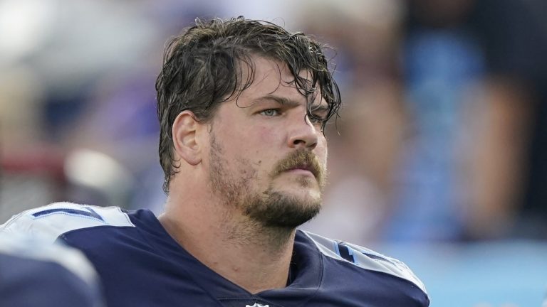 Former Tennessee Titans offensive tackle Taylor Lewan walks off the field at halftime of an NFL football game against the New York Giants, Sunday, Sept. 11, 2022, in Nashville, Tenn. (AP Photo/Mark Humphrey, File)