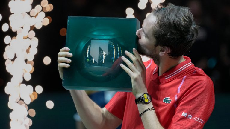 Russia's Daniil Medvedev kisses the trophy after winning the men's final tennis match of the ABN AMRO tournament against Italy's Jannik Sinner at the Ahoy Arena in Rotterdam, Netherlands, Sunday, Feb. 19, 2023. (Peter Dejong/AP)