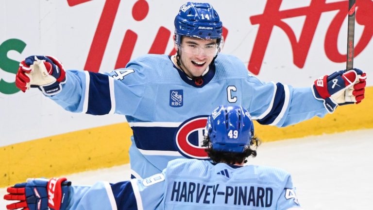 Montreal Canadiens' Rafael Harvey-Pinard (49) celebrates with teammate Nick Suzuki after scoring against the Ottawa Senators during third period NHL hockey action in Montreal. (Graham Hughes/CP)