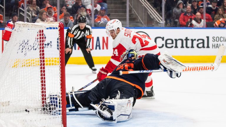 Detroit Red Wings' Pius Suter (24) scores on Edmonton Oilers goalie Jack Campbell (36) during shootout NHL action in Edmonton on Wednesday February 15, 2023. (Jason Franson/CP)