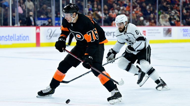 Philadelphia Flyers' Isaac Ratcliffe (76) skates past the defense of Los Angeles Kings' Drew Doughty during the second period of an NHL hockey game, Saturday, Jan. 29, 2022, in Philadelphia. (Derik Hamilton/AP)