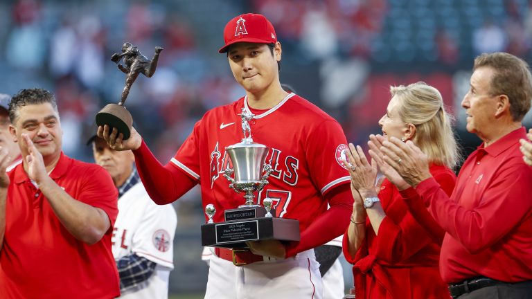 Los Angeles Angels' Shohei Ohtani, center, receives the Nick Adenhart Pitcher of the Year and Angels team MVP awards prior to the team's baseball game against the Texas Rangers in Anaheim, Calif., Saturday, Oct. 1, 2022. (Ringo H.W. Chiu/AP)