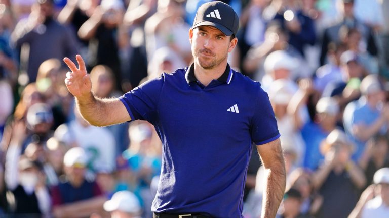 Nick Taylor acknowledges the crowd on the 18th hole during the final round of the Phoenix Open golf tournament, Sunday, Feb. 12, 2023, in Scottsdale, Ariz. (Darryl Webb/AP)