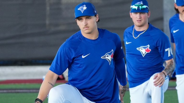 Toronto Blue Jays pitcher Ricky Tiedemann, front, warms up during baseball spring training in Dunedin, Fla., Monday, Feb. 20, 2023. (Nathan Denette/CP)