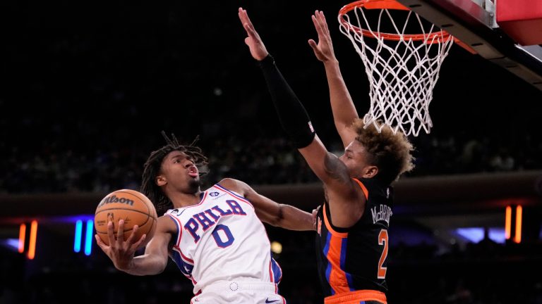 Philadelphia 76ers guard Tyrese Maxey (0) shoots against New York Knicks guard Miles McBride (2) during the first half of an NBA basketball game, Sunday, Feb. 5, 2023, in New York. (John Minchillo/AP)