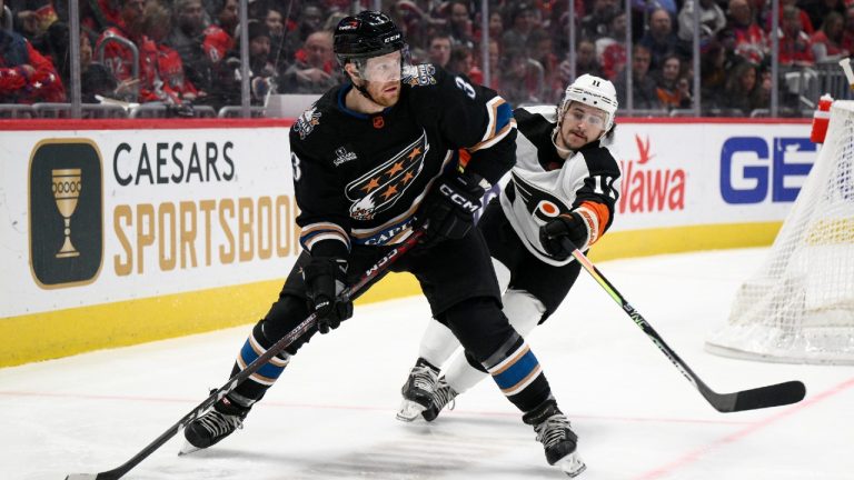 Washington Capitals defenceman Nick Jensen (3) is defended by Philadelphia Flyers right wing Travis Konecny (11) during the second period of an NHL hockey game Saturday, Jan. 14, 2023, in Washington. (Nick Wass/AP)